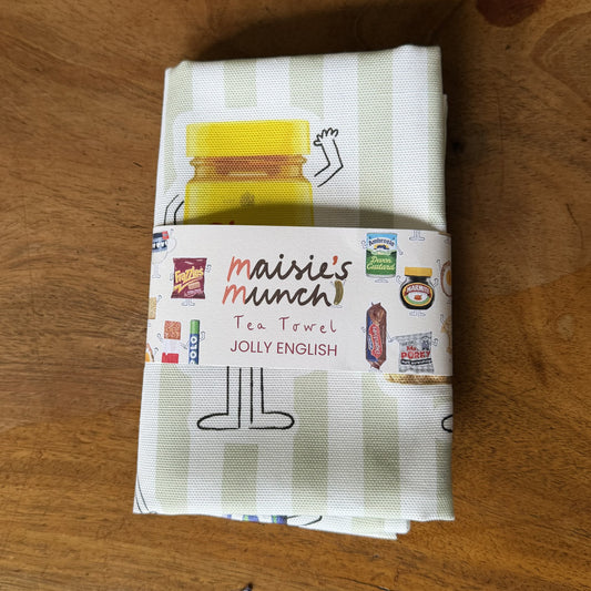 Jolly English tea towel folded in its Maisie's Munch paper band