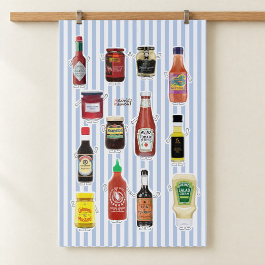 Condiments tea towel hanging from a wooden rail