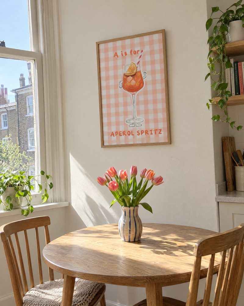 Framed A is for Aperol Spritz print in a sunny kitchen